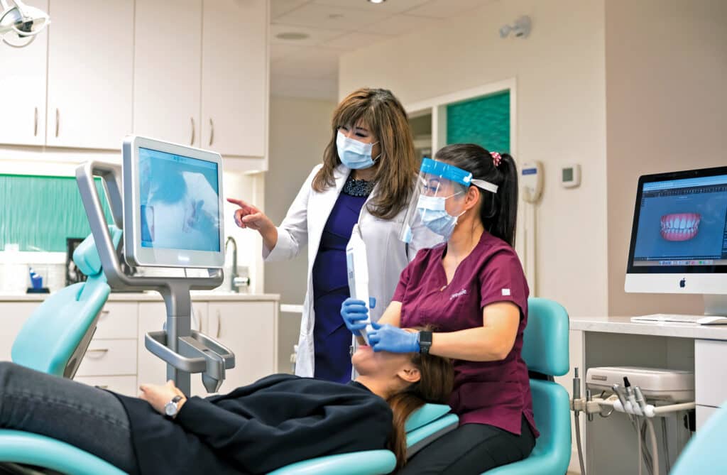 Sandra Tai and Assistant with intraoral scanner