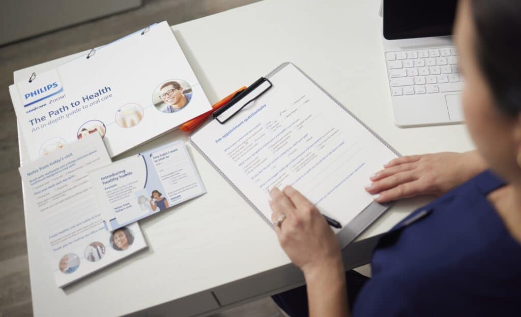 Orthodontist looking at Philips Path to Health Toolset on a desk
