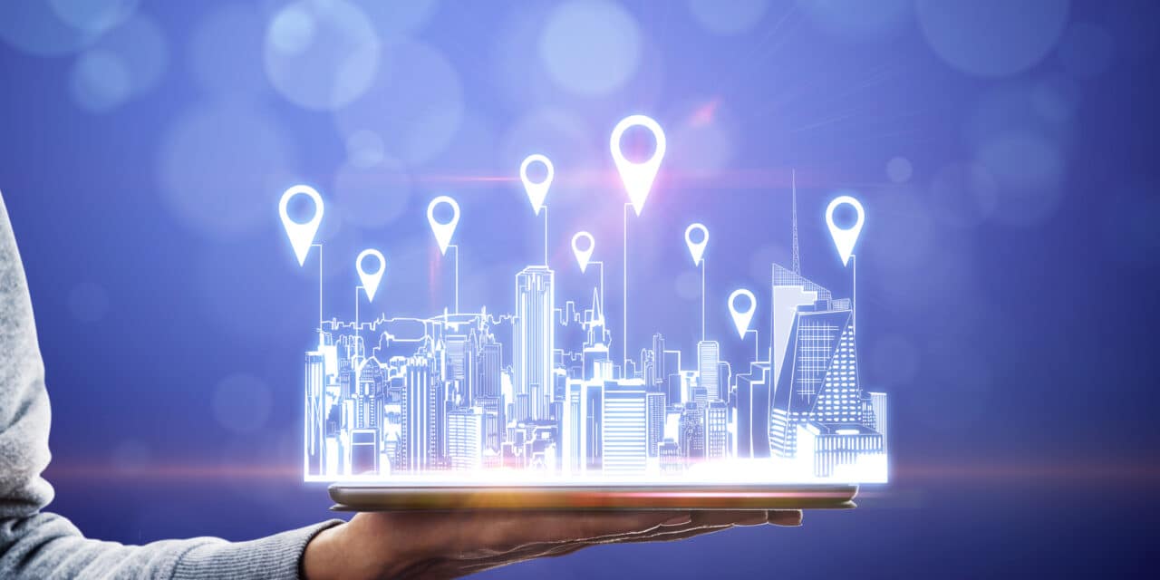 city hologram on tablet with location pins to indicate location expansion